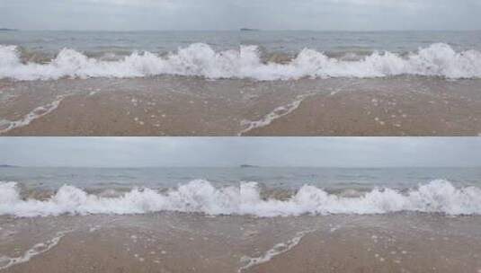 阴天海边清澈的海水拍打在沙滩上高清在线视频素材下载