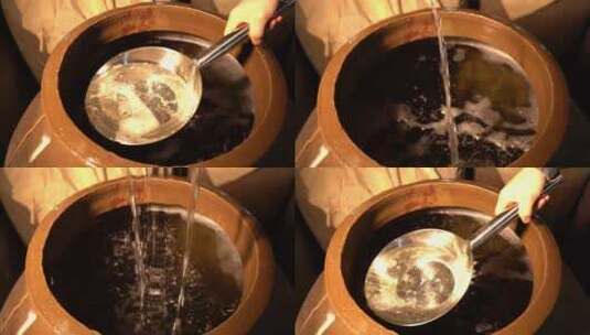 陶坛酒窖舀酒高清在线视频素材下载