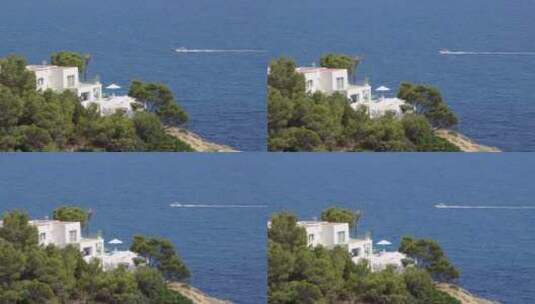 海边别墅与海面上的小船高清在线视频素材下载