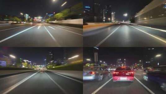 夜晚驾车行驶在市区道路高清在线视频素材下载