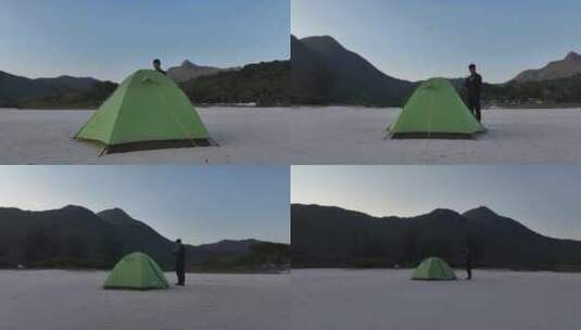 男子站在帐篷边航拍高清在线视频素材下载