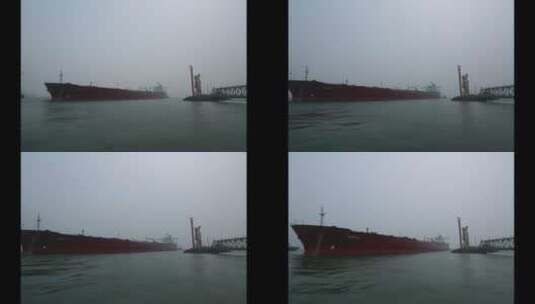 天津港口 货轮边排水边停靠码头高清在线视频素材下载
