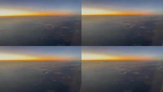 云层之上飞机舷窗外的傍晚自然风光高清在线视频素材下载