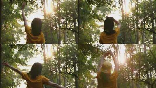 森林里女孩向太阳招手视频素材高清在线视频素材下载