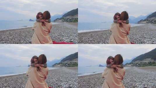 海边小女孩和妈妈拥抱高清在线视频素材下载