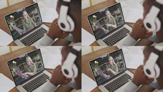 非裔美国男大学生戴着耳机在家里的笔记本电脑上进行视频通话高清在线视频素材下载