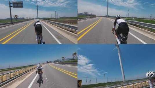 航拍美女公路骑自行车骑行风车蓝天白云高清在线视频素材下载