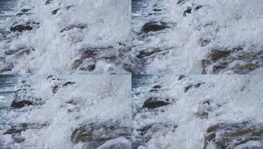 流动的溪流水流和飞溅的水花慢镜头高清在线视频素材下载
