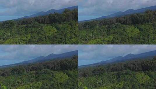 毛伊岛北岸热带悬崖边和斜坡山丘的长焦全景高清在线视频素材下载