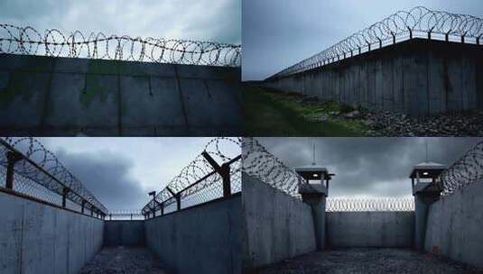 监狱高墙带刺铁丝网围墙高清在线视频素材下载