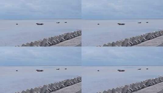 海边防波堤与海面船只素材高清在线视频素材下载