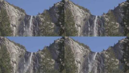 瀑布从落基山悬崖上流下高清在线视频素材下载