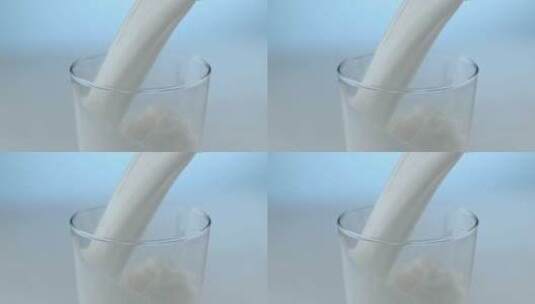 牛奶倒入空的玻璃杯中高清在线视频素材下载