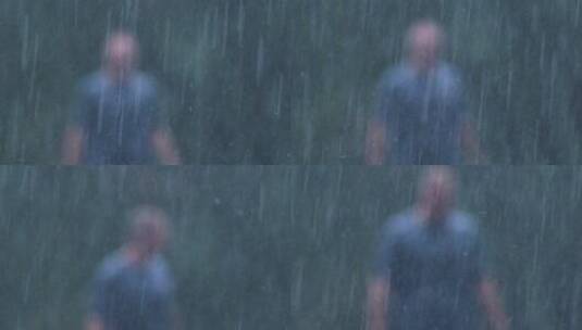 雨天模糊不清的男人走向镜头高清在线视频素材下载