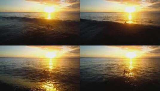 一名女子划着冲浪板越过波浪进入夕阳高清在线视频素材下载