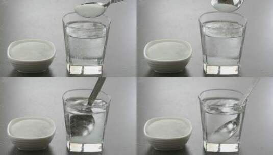 在玻璃杯里把糖和水混合高清在线视频素材下载