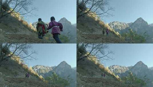 藏族男孩牵着女孩在山上奔跑高清在线视频素材下载