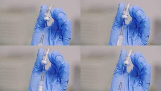注射器从瓶子里吸取液体药物高清在线视频素材下载