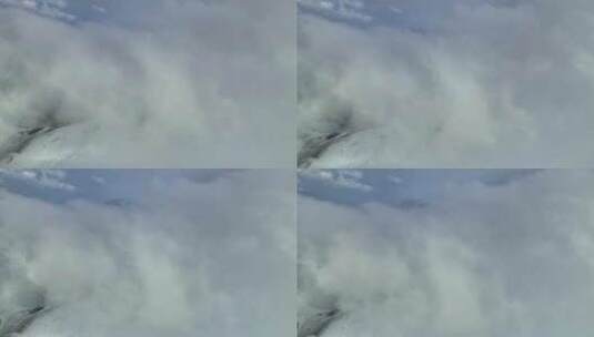 航拍川西沙鲁里山脉云雾中的雪山高清在线视频素材下载