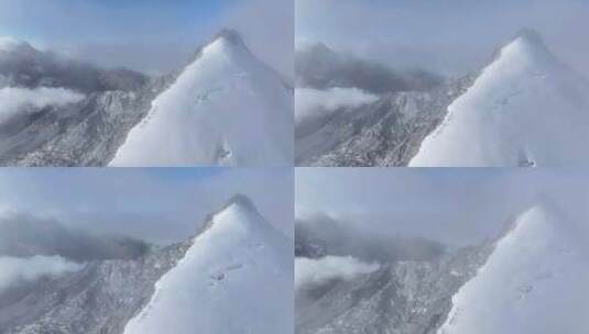 航拍攀登横断山脉乌库楚雪山山脊上的登山者高清在线视频素材下载