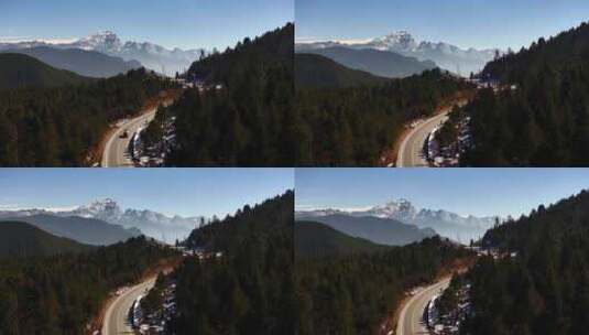 航拍雪山森林公路车辆行驶高清在线视频素材下载