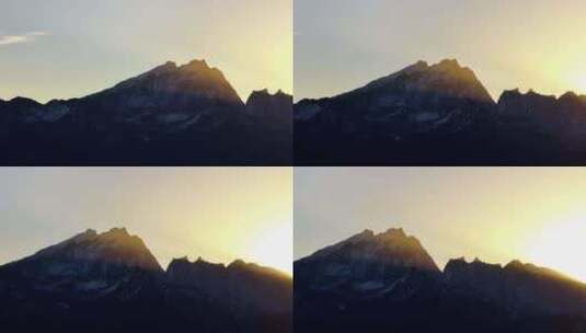 航拍清晨的阳光照耀在哈巴雪山山顶高清在线视频素材下载
