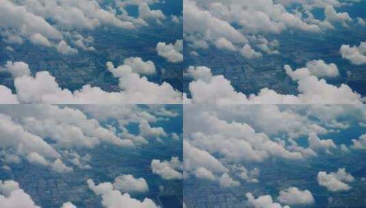 从飞机上俯视窗外的云朵陆地高清在线视频素材下载