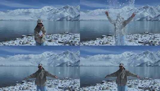 （慢镜）雪山湖泊蓝天白云美女玩雪撒雪高清在线视频素材下载