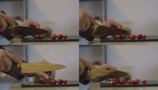 一名男子将樱桃西红柿切成自制鳄梨色拉酱。高清在线视频素材下载