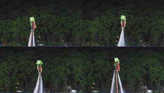 唯美城市夜晚水上飞人舞狮表演传统喜庆隆重高清在线视频素材下载