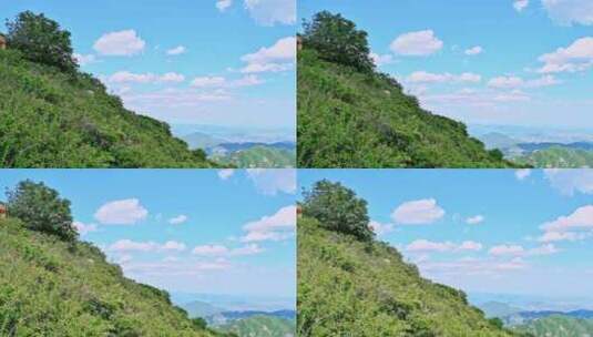 夏季蓝天白云绿色大山山顶全景风光高清在线视频素材下载