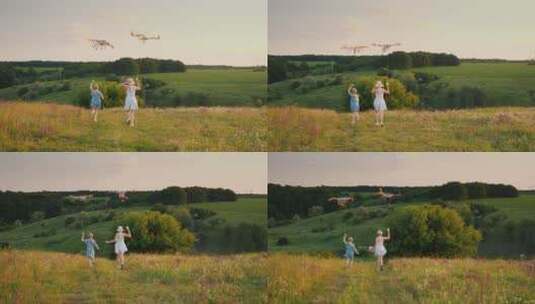 女孩和妈妈在田野里快乐的放风筝高清在线视频素材下载