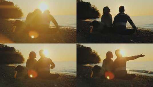 夫妇在海岸看日落高清在线视频素材下载