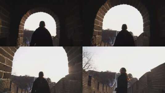 女人从长城的瞭望塔里走出高清在线视频素材下载