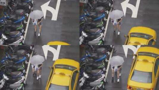 撑着雨伞走在雨下的两个女孩高清在线视频素材下载