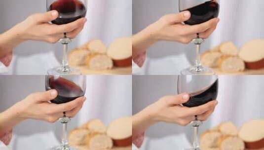 在玻璃杯里混合红酒的女人高清在线视频素材下载