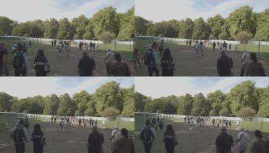 哀悼者走进绿色公园纪念的跟踪镜头高清在线视频素材下载