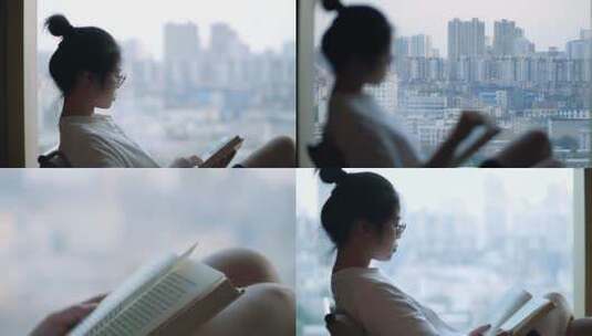 女孩在落地窗前看书4k视频素材高清在线视频素材下载