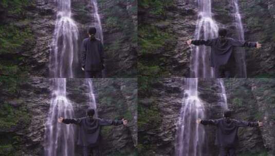 女性游客背影面向山水感受亲近自然山峰瀑布高清在线视频素材下载