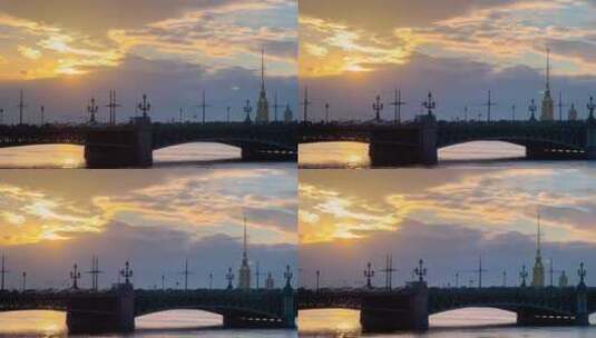 日落时特洛伊茨基桥和彼得和保罗堡垒的全景戏剧性的橙色天空风暴云高清在线视频素材下载