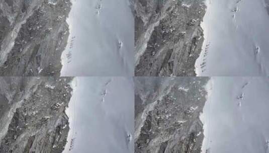航拍攀登横断山脉乌库楚雪山山脊上的登山者高清在线视频素材下载