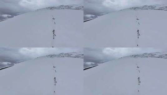 航拍攀登慕士塔格峰雪山冰川的登山队高清在线视频素材下载