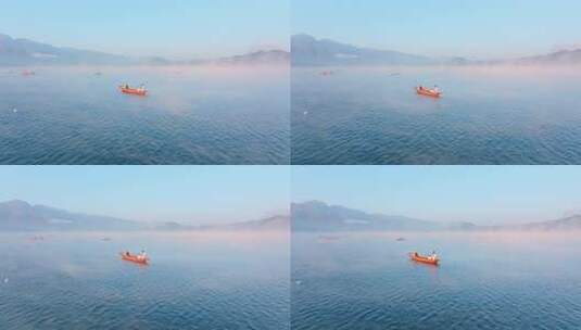 航拍情侣乘船游玩泸沽湖高清在线视频素材下载