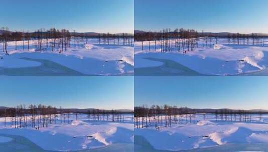 夕阳下内蒙古北方不冻河平静水面雪雾袅袅高清在线视频素材下载