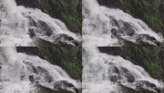 从岩石中倾泻而下的瀑布高清在线视频素材下载