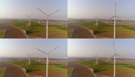 农田里转动的风力发电机高清在线视频素材下载