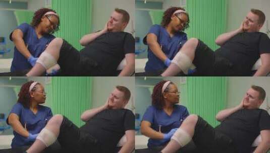 女护士为病人包扎受伤的腿高清在线视频素材下载