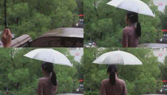 下雨场景，旗袍女孩打伞撑在雨中，雨滴落下高清在线视频素材下载