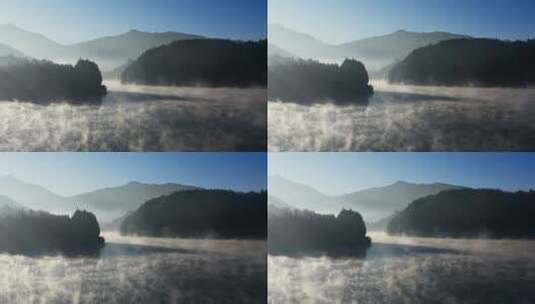 早晨山间水气腾腾的湖面高清在线视频素材下载
