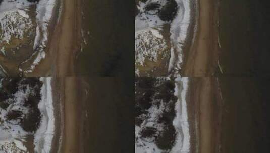 小浪撞击冰冷的海滩高清在线视频素材下载